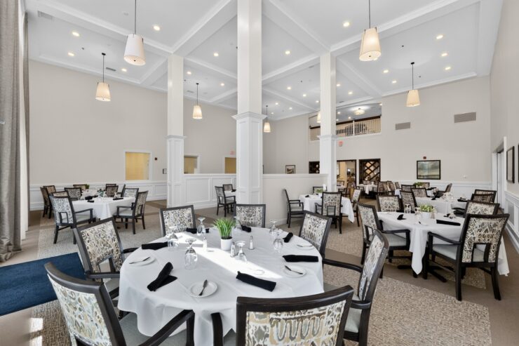 Bright, spacious dining area with elegant seating designed for communal comfort and connection.
