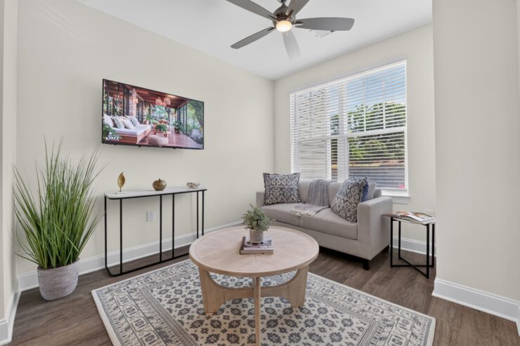 Bright living area with comfortable seating, natural light, and inviting decor for relaxation.