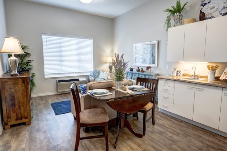 Bright and inviting living area with dining table, comfortable seating, and warm décor.