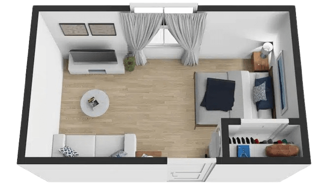 Spacious and welcoming studio with natural light, comfortable seating, and restful sleeping area.
