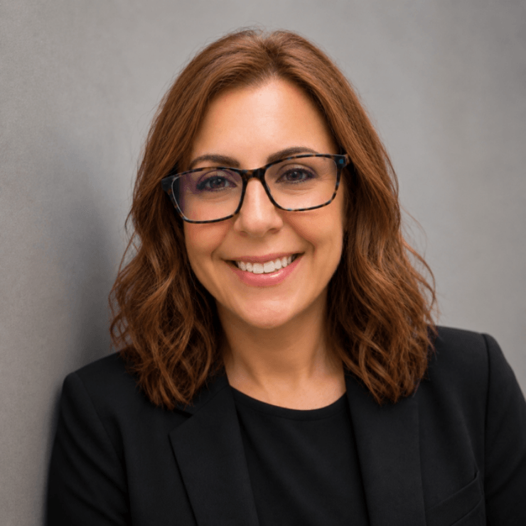 Friendly professional woman smiling warmly, symbolizing care and trust in the community.