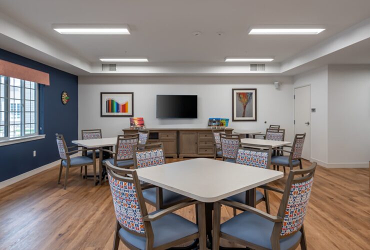 Bright and inviting community room with comfortable seating and cheerful decor for socializing.