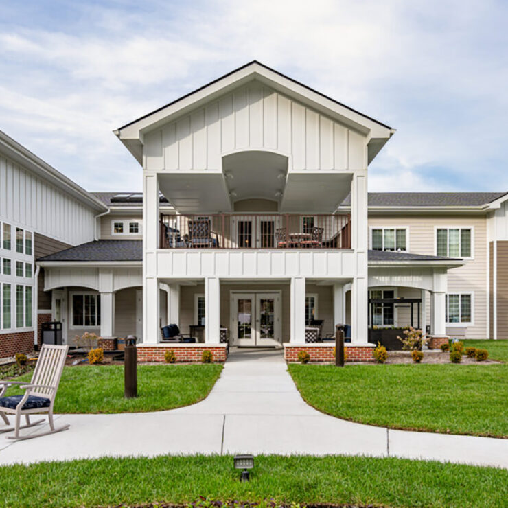 Well-maintained retirement community with inviting outdoor seating and spacious porches.