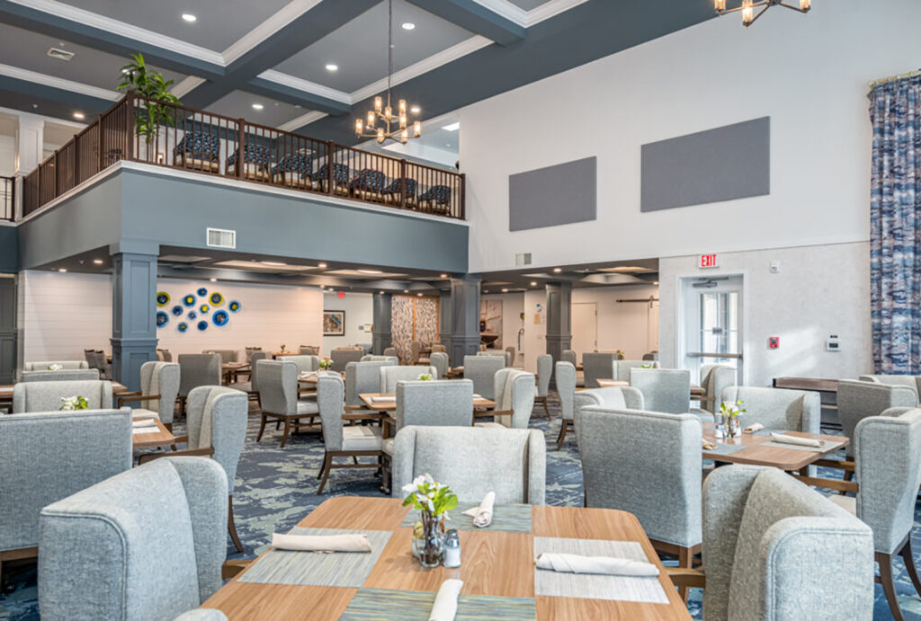 Bright, spacious dining area with comfortable seating designed for a welcoming community experience.