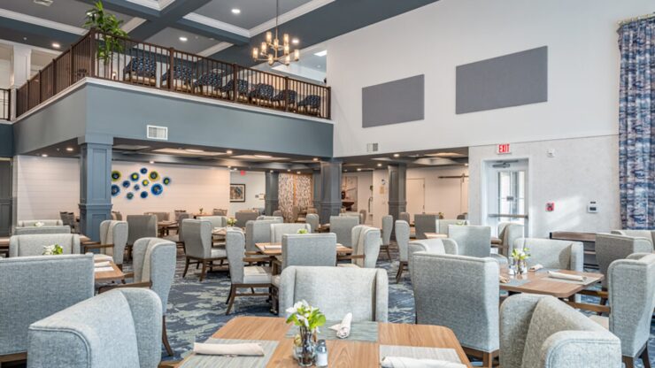 Bright, spacious dining area with comfortable seating designed for a welcoming community experience.