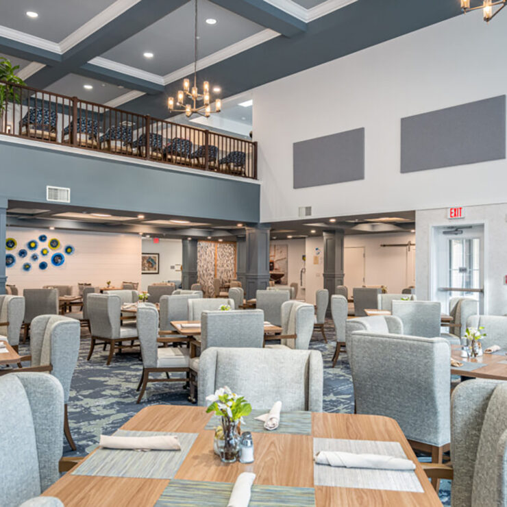 Bright, spacious dining area with comfortable seating designed for a welcoming community experience.