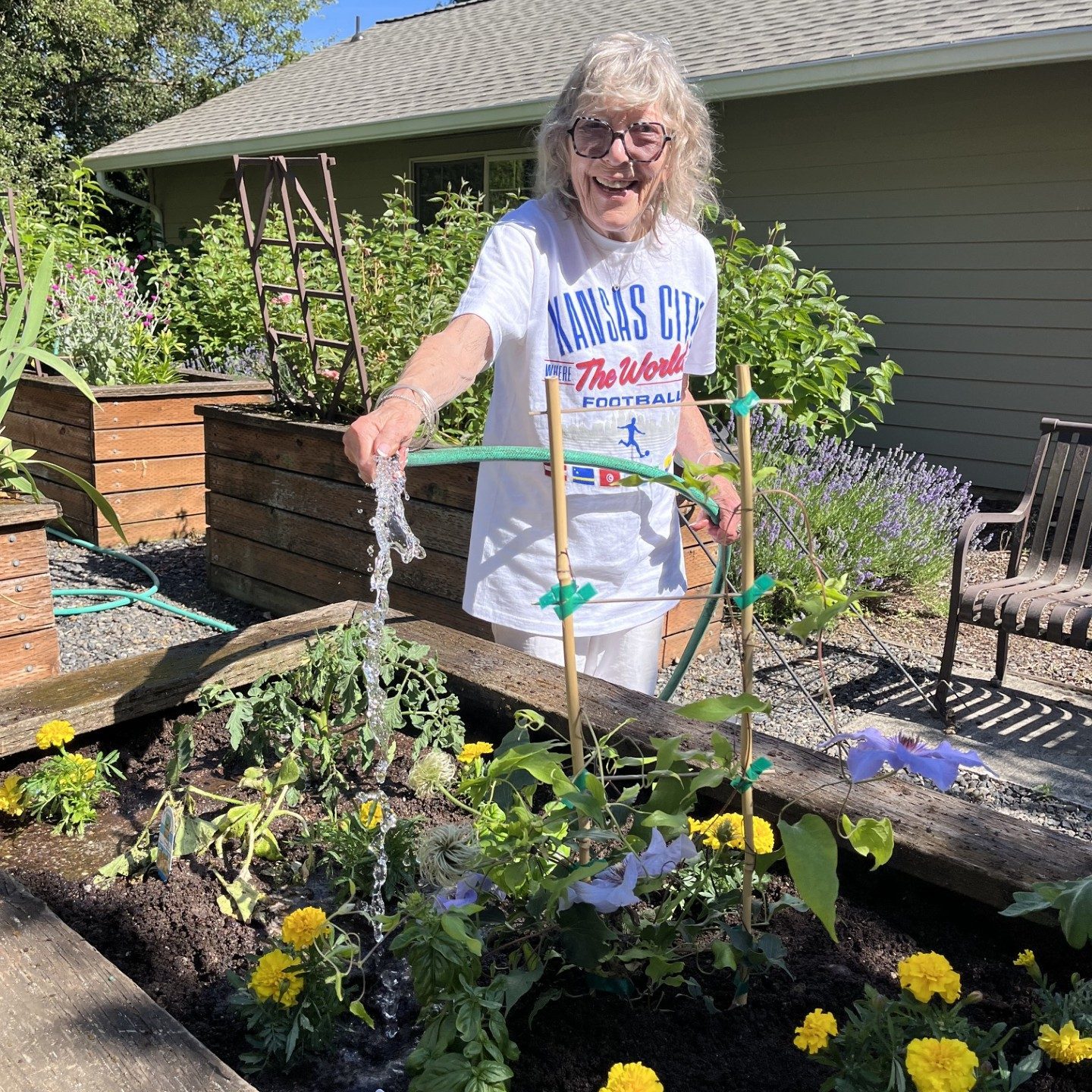 🌱 Gardening joy at Cogir of Vancouver! 🍅🌻 Betsy is all smiles today, tending to our community vibrant, blooming garden. The tomatoes are coming on beautifully, the melons are vining, and the squash are coming on wonderfully. Even better? Our corn is officially ready to transplant! A huge thank you to everyone that got their hands dirty and helping our patch of green flourish. There is nothing quite like fresh, homegrown veggies and sharing the joy of gardening together. #CogirOfVancouver #SeniorLiving #CogirCares #GardenLife
