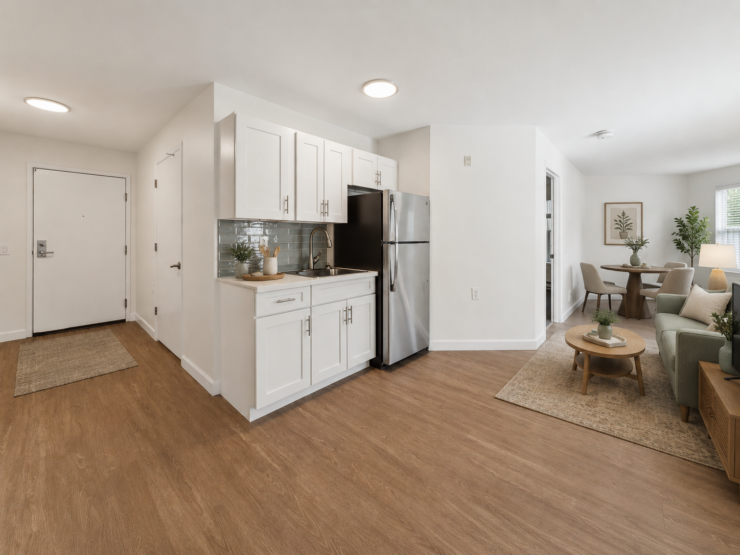 Bright and inviting open-concept living space with modern kitchen and comfortable seating area.