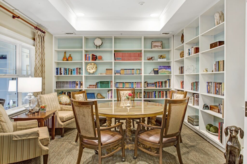 Inviting library space with comfortable seating, bookshelves, and natural light for community gatherings.