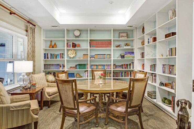 Inviting library space with comfortable seating, bookshelves, and natural light for community gatherings.