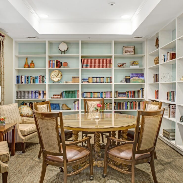 Inviting library space with comfortable seating, bookshelves, and natural light for community gatherings.