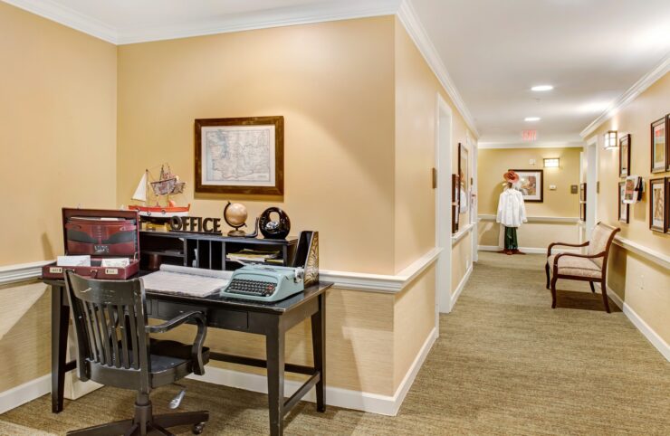 Warm, inviting hallway with vintage decor and comfortable seating fostering a welcoming community atmosphere.