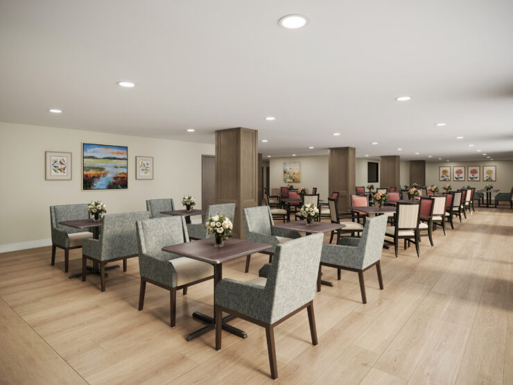 Bright dining room with comfortable seating, floral centerpieces, and artwork creating a welcoming space.