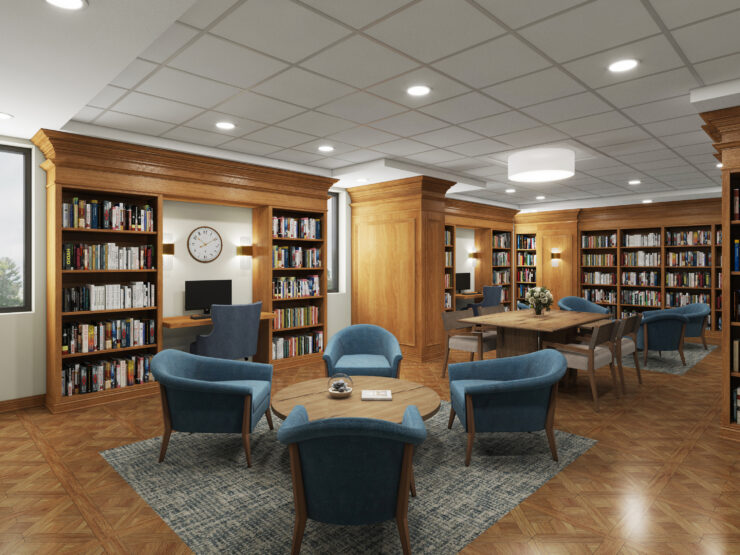 Warm library space with wooden shelves, comfortable seating, and workstations for residents to enjoy.