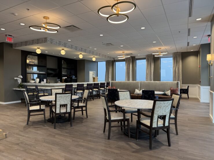 Spacious dining and lounge area with elegant lighting and comfortable seating for social gatherings.