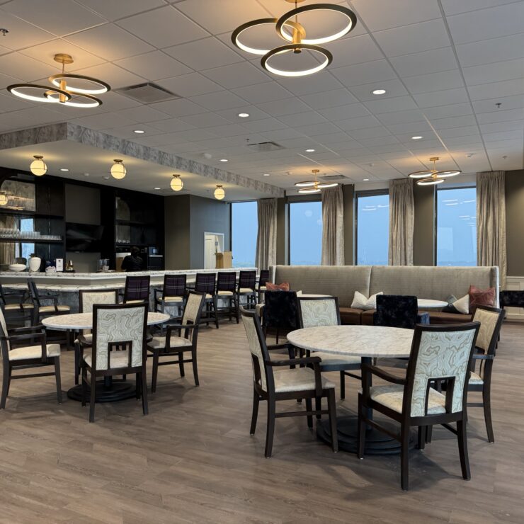 Spacious dining and lounge area with elegant lighting and comfortable seating for social gatherings.