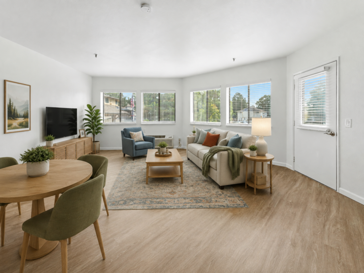 Bright and inviting living area with comfortable seating, natural light, and warm decor.