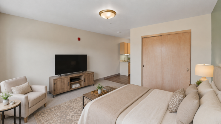 Inviting living space with comfortable seating, a large TV, and warm, neutral decor for relaxation.