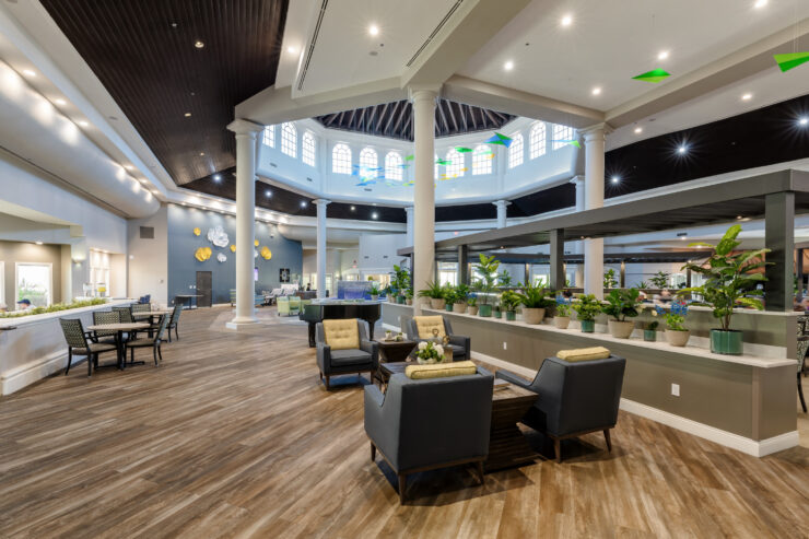 Spacious community lounge with natural light, comfortable seating, and a welcoming atmosphere.
