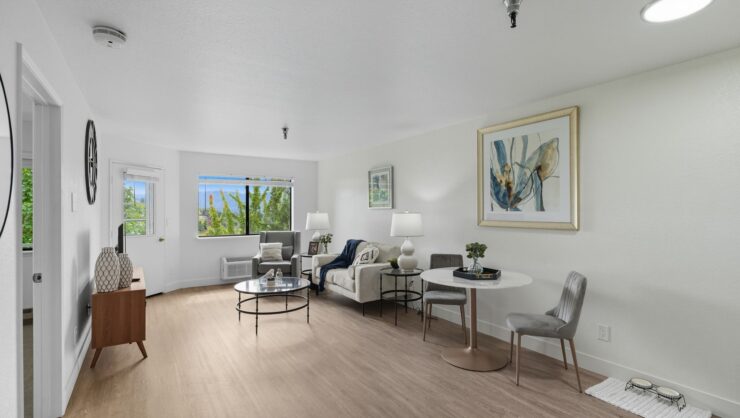 Bright, inviting living area with comfortable seating, natural light, and homey decor for relaxed socializing.