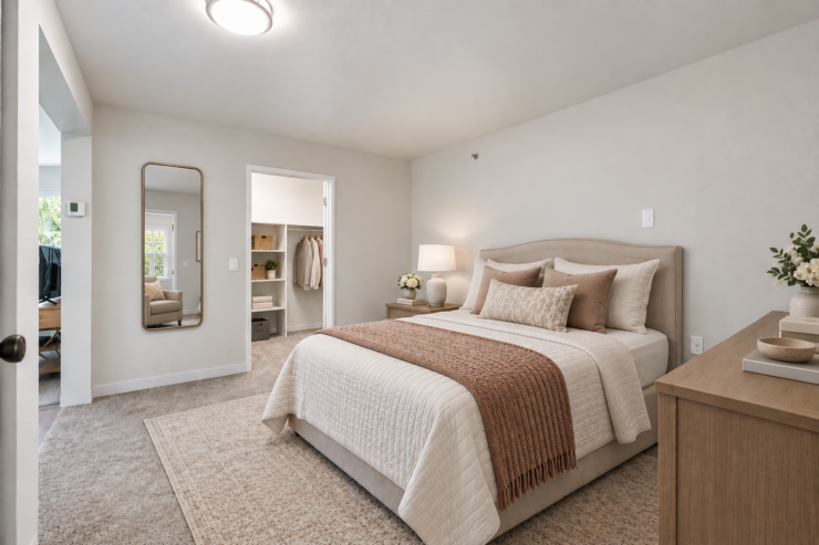 Spacious bedroom with soft lighting and warm tones, creating a peaceful and inviting retreat.