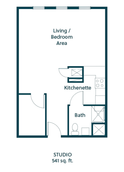 Open studio layout with kitchen, bath, and spacious living area designed for comfort and ease.