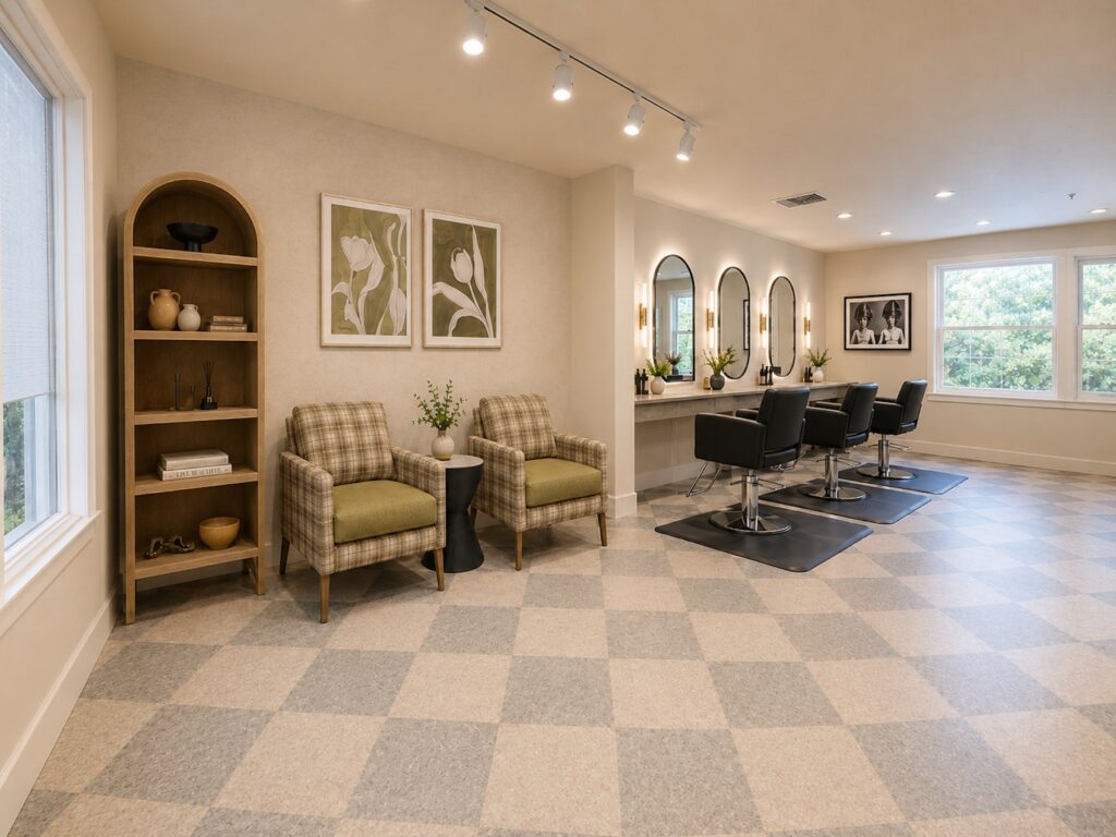 Bright salon area with comfortable seating, large mirrors, and natural light for a welcoming community space