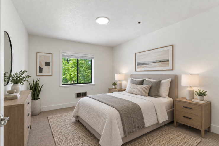 Bright, inviting bedroom with natural light, soft linens, and warm wooden furniture for peaceful living.