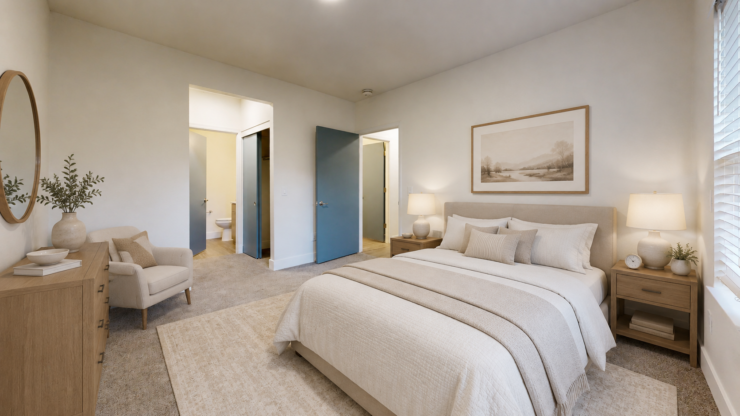 Spacious and inviting bedroom with soft lighting, comfortable seating, and calming decor.