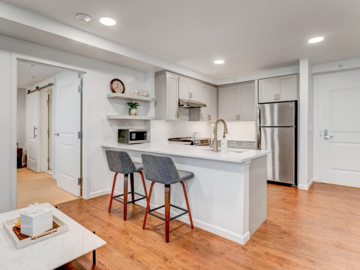 Bright, modern kitchen and dining area with comfortable seating promoting a warm community feel.