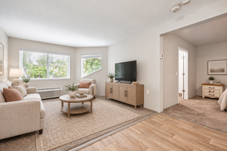 Bright living room with comfortable seating, natural light, and warm, inviting decor.