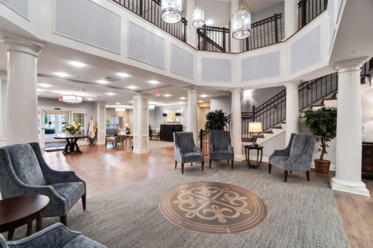 Spacious and inviting retirement home lobby with comfortable seating and elegant décor.