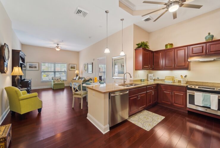 Spacious kitchen and living area with warm wood floors and inviting seating for gatherings.