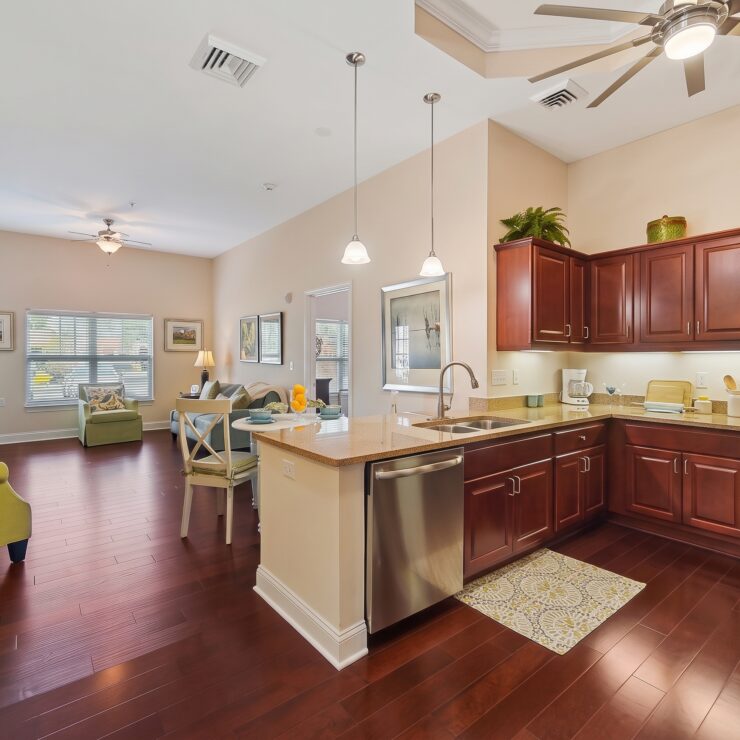 Spacious kitchen and living area with warm wood floors and inviting seating for gatherings.