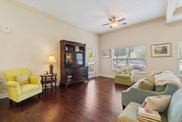 Bright and inviting common room with comfortable seating and natural light for relaxed gatherings.