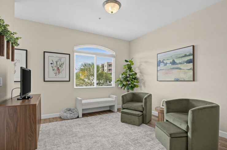 Bright living area with comfortable seating, peaceful decor, and natural light fostering community.