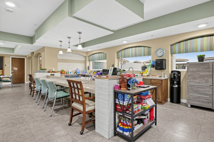 Bright activity room with games, comfortable seating, and natural light fostering community engagement.