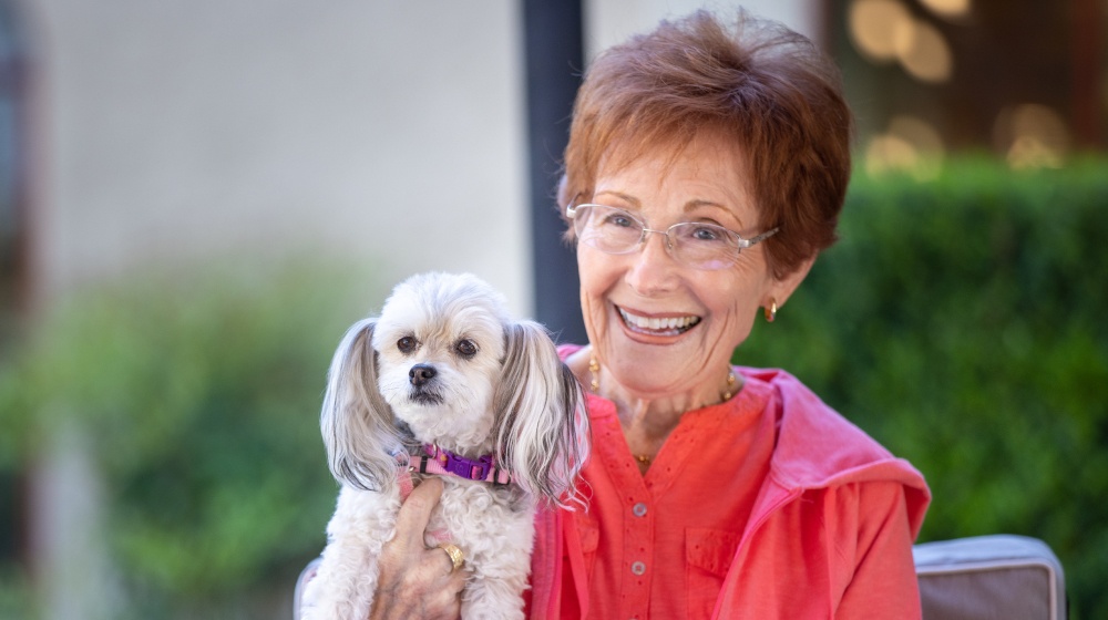 Senior smiling with dog