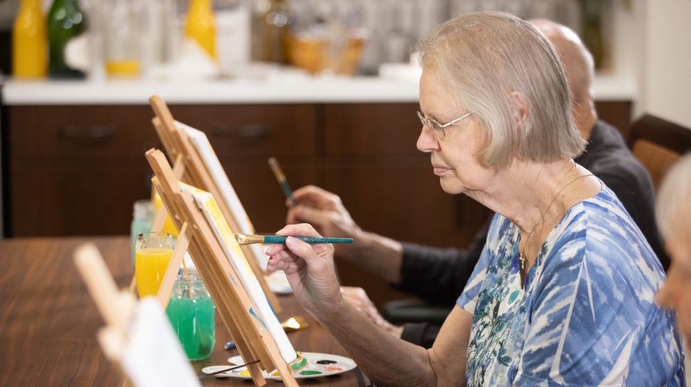 residents in a painting class